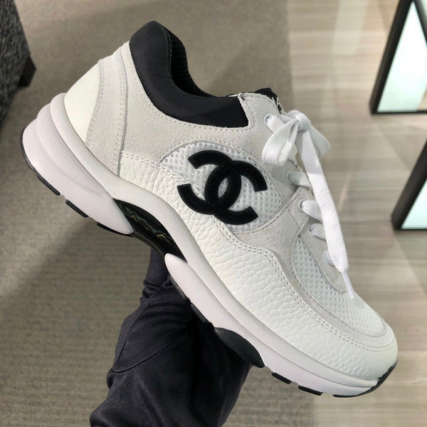Chanel CC Logo Runner Sneaker White/Black 2021 – The Luxury Shopper