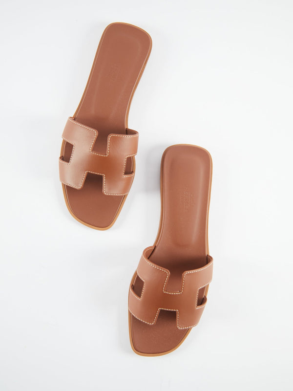 Hermès Oran Sandals (Gold Piqûres Écrues)